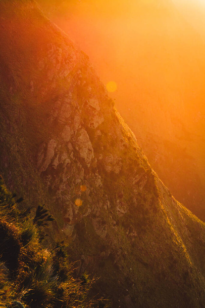 A beautiful shot of the sunset over the mountain range - Фото, зображення