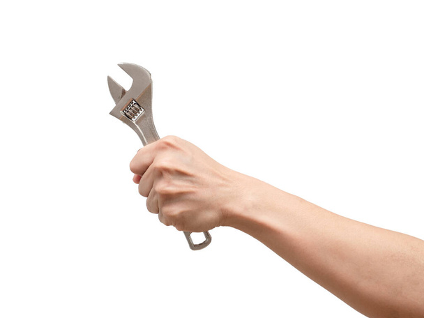 Hand holding adjustable wrench on white isolated background,Labor tool technician - Fotó, kép
