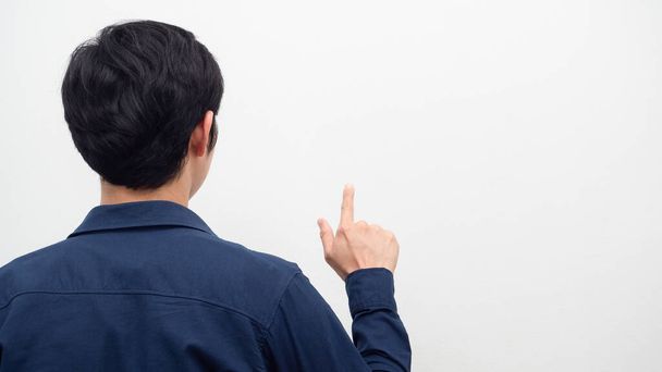 Man turn back show finger gesture touch screen at copy space white background - Photo, Image