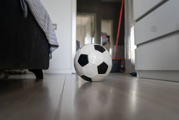 soccer football ball on the floor in bright room in day no people copy space - Foto, imagen