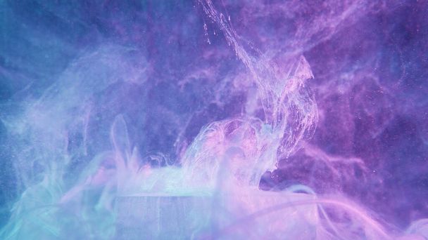 Glitter fluid splash. Neon mist texture. Fantasy explosion. Fluorescent glowing purple blue color shiny ink water splatter over ice cube on vapor cloud abstract background. - Foto, afbeelding