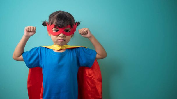 The little girl child in a superhero costume - Foto, afbeelding