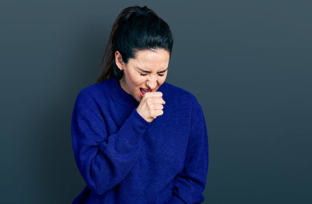 Young hispanic woman wearing casual clothes feeling unwell and coughing as symptom for cold or bronchitis. health care concept.  - Photo, Image