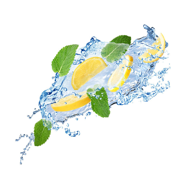 Fresh ripe lemon, mint and splashing water on white background - Photo, image