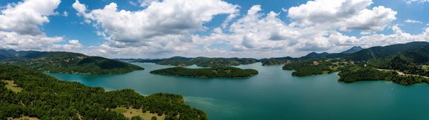 Plastiras Lake, Greece Panoramic aerial view, blue sky with clouds. Also called Tavropos Reservoir is an artificial lake fed by Megdovas river in Karditsa, Thessaly. - Photo, Image