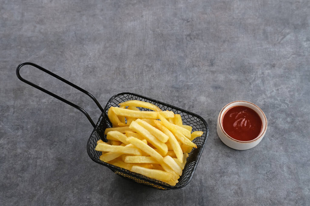 French Fries, tasty and savory fast food served with chili sauce. Space for text. - Valokuva, kuva