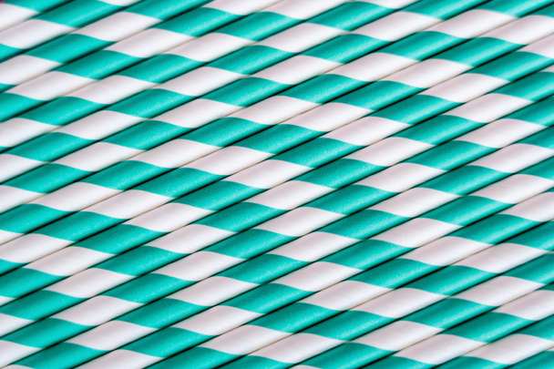 top view of striped blue and white straws as backdrop  - Foto, imagen