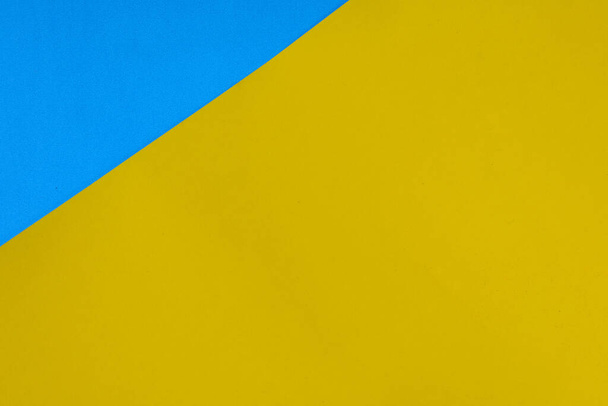 A wallpaper of blue and yellow papers - Foto, Bild