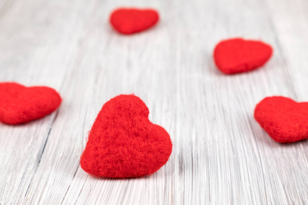A closeup of red hearts on a rustic wooden background - Foto, immagini