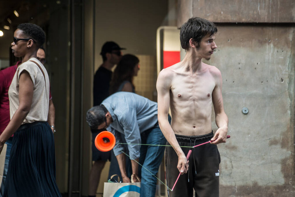 Strasbourg - France - 25 June 2022 - portrait of young man playing with diabolo in the street  - 写真・画像
