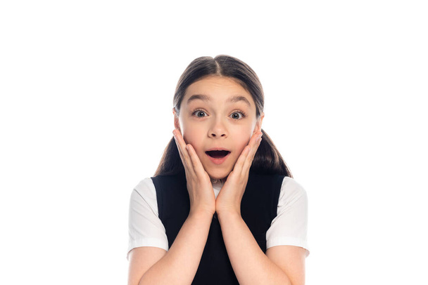 Excited schoolchild looking at camera isolated on white  - Φωτογραφία, εικόνα