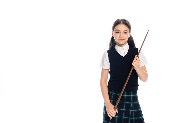 Smiling schoolkid holding pointer isolated on white  - Photo, Image