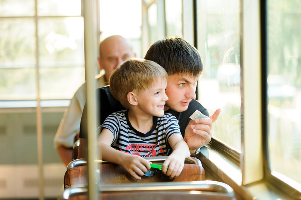 father and son in a public transport - Photo, Image