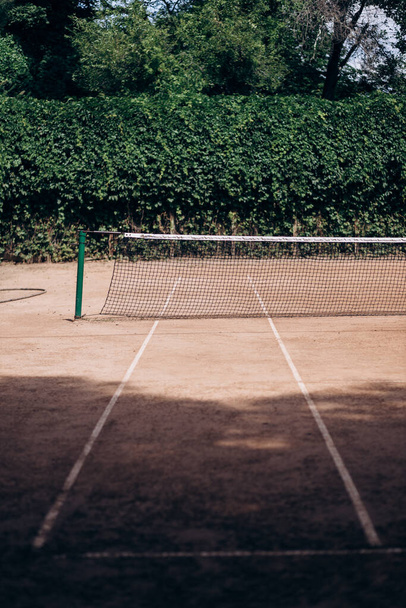 Earth tennis court on a sunny day - Photo, Image