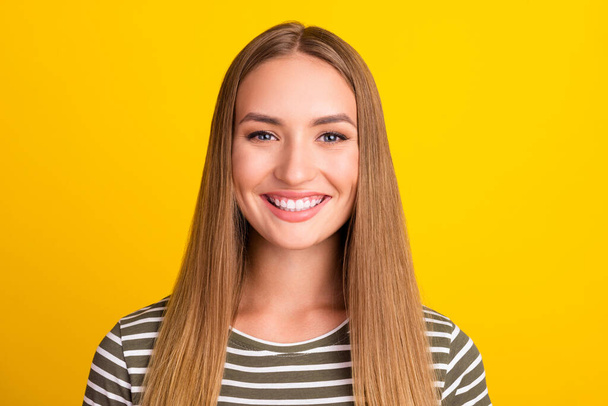 Photo of adorable satisfied friendly young person toothy beaming smile isolated on yellow color background. - Foto, Imagen
