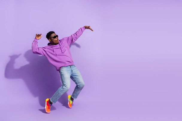 Full length profile photo of overjoyed carefree person stand tip toe dancing isolated on purple color background. - Photo, image
