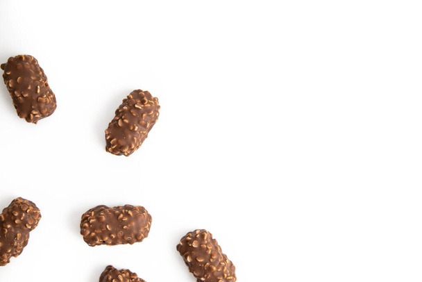 Chocolate candy bars wafers handmade lie on a white background. Top vew, flat lay. - Photo, Image