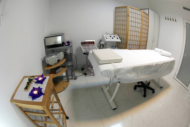 The interior of the massage room, massage table in the spa, skin treatment. - Photo, Image