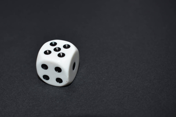 White dice close up on black background - Photo, image