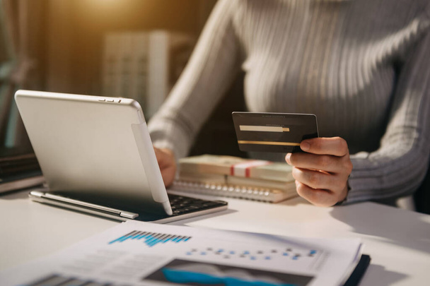 Business woman hands using smartphone and holding credit card with digital layer effect diagram as Online shopping concept at offic - Φωτογραφία, εικόνα