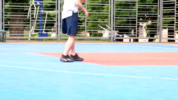 crop video of man legs playing basketball outdoors - Felvétel, videó