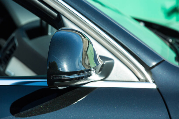 AUDI Q3 in black. Subcompact luxury crossover Audi Q3. Side mirror view - Φωτογραφία, εικόνα