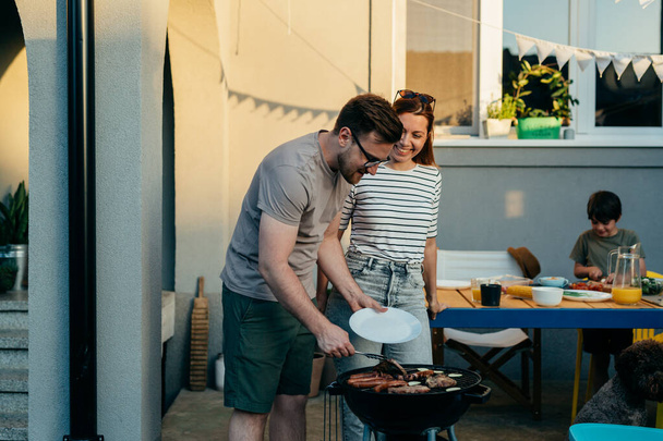 happy caucasian family barbecue in garden - Zdjęcie, obraz