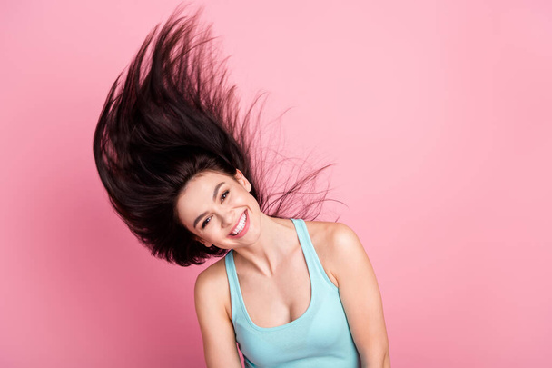 Photo of shiny beauty millennial lady hair up wear blue top isolated on pink color background. - Foto, Imagen