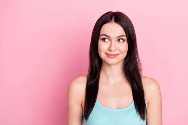 Photo of sporty lovely brown long hairdo lady look empty space wear blue top isolated on pastel pink color background. - Φωτογραφία, εικόνα