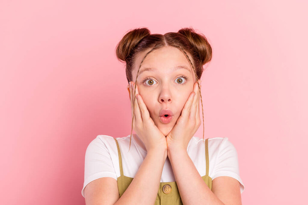 Portrait of attractive funky amazed pre-teen girl pout lips sudden news reaction isolated over pink pastel color background. - Photo, Image