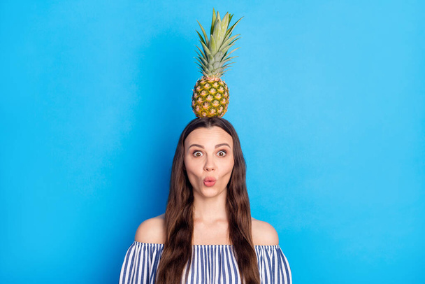 Photo portrait woman amazed playful got pineapple on head childish isolated vibrant blue color background. - Fotografie, Obrázek