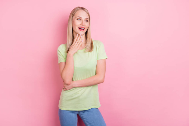 Photo of lovely tempting pretty lady look empty space wear green t-shirt isolated on pink background. - Foto, imagen