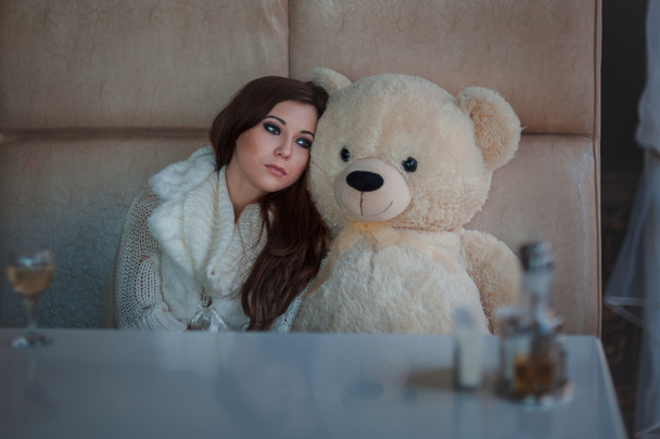 Sad girl with toy bear. - Valokuva, kuva