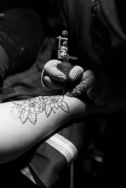 tattoo artist getting a tattoo done - Photo, Image
