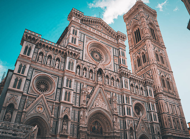 A low angle shot of Santa Maria del Fiore Cathedral in Florence with clouds above - 写真・画像
