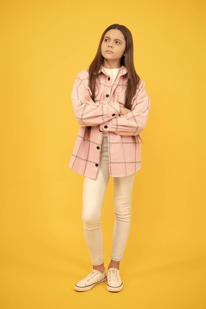 serious kid girl wear pink checkered shirt, fashion. - Photo, Image