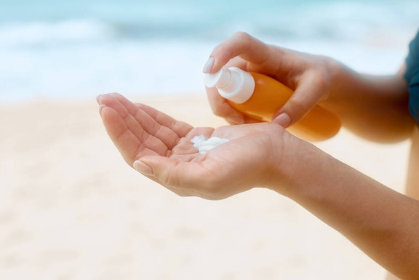  Female Hands With Sun Protection Cream Skin Care Concept. Sunscreen Solar. The Girl Uses  Moisturizer Sunblock. - Foto, imagen