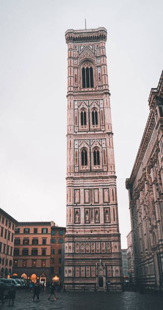 A vertical low angle shot of tower of Cathedral of Santa Maria del Fiore - Zdjęcie, obraz
