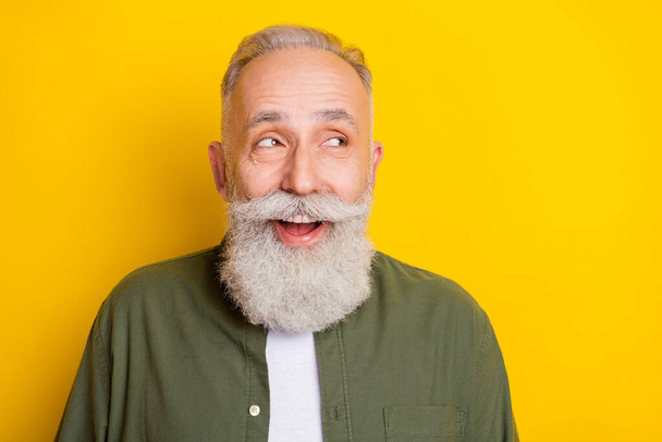 Photo portrait of senior man cheerful happy looking blank space laughing isolated on bright yellow color background. - Foto, afbeelding