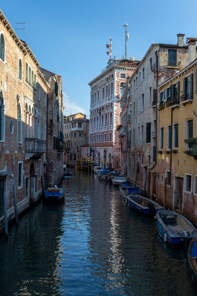 Venice, Italy - 06 11 2022: Narrow canal in Venice on a summer morning. - Zdjęcie, obraz