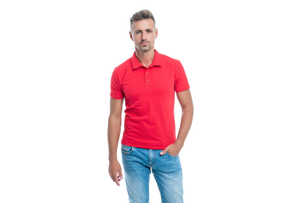 handsome man with grizzled hair in red shirt standing isolated on white background. - Photo, Image