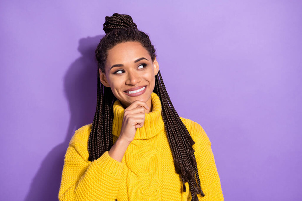 Photo of young attractive afro woman happy positive think dream hand touch chin look empty space isolated over violet color background. - Foto, imagen