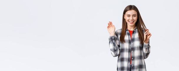 Lifestyle, different emotions, leisure activities concept. Friendly attractive young woman saying hi or bye, waving hand in greeting with happy enthusiastic smile, meeting fellow students. - Photo, Image