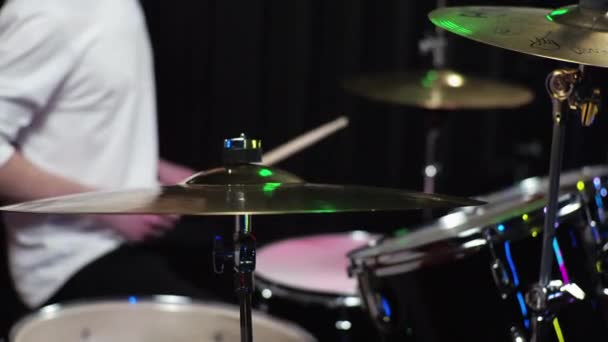 A young guy novice drummer is learning to play the drum kit. - Footage, Video