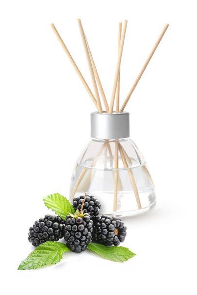 Reed diffuser and blackberry on white background - Photo, image