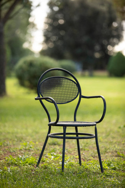 lone designer chair in the park on the lawn - Fotografie, Obrázek