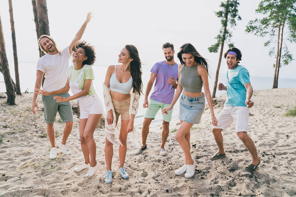 Photo of funny cool young buddies dressed casual outfits enjoying summer event outdoors countryside. - Foto, imagen