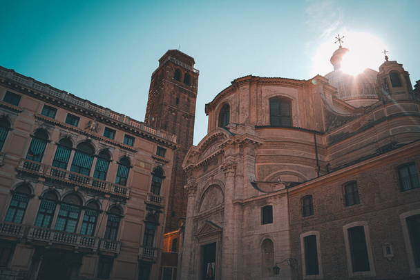 A beautiful shot of a church tower in Venice during the sunrise - 写真・画像