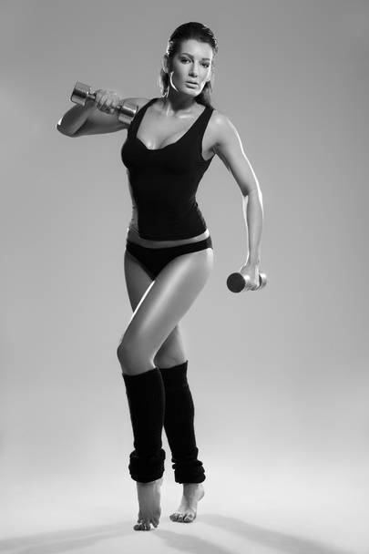 Female exerciser weights - Foto, Imagen