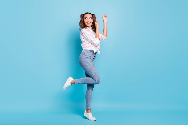Full length body size profile side view of lovely cheerful girl dancing having fun pastime isolated on vivid blue color background. - Фото, зображення
